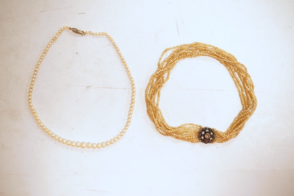 An eight-strand seed pearl choker necklace, with a rose-cut diamond clasp, length 34cm, pearls untested; together with a single strand graduated cultured pearl necklace, length 40cm, clasp stamped 9ct, Condition: good, s